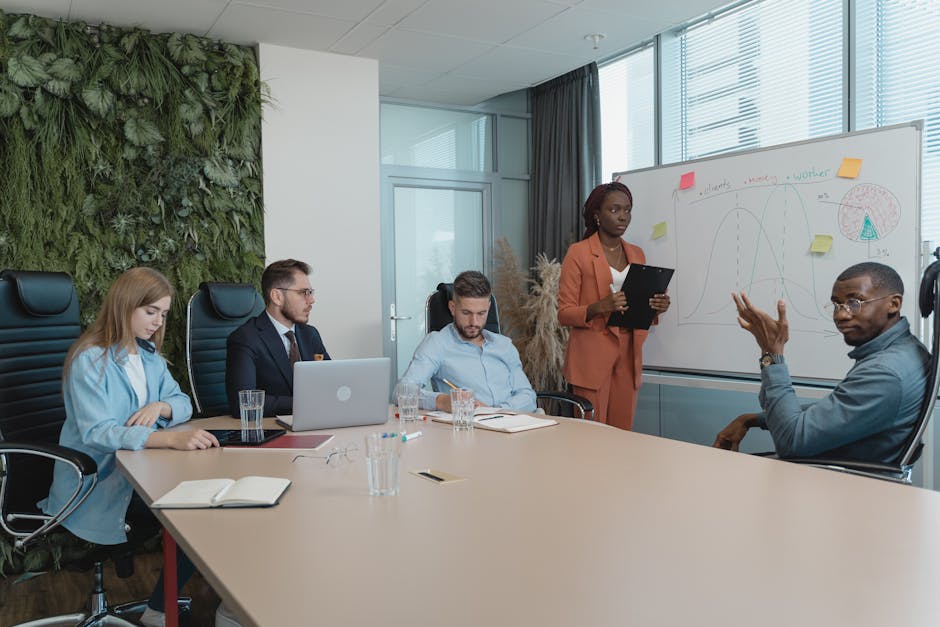 Diverse group of professionals engaged in an innovative brainstorming session in a modern office setting